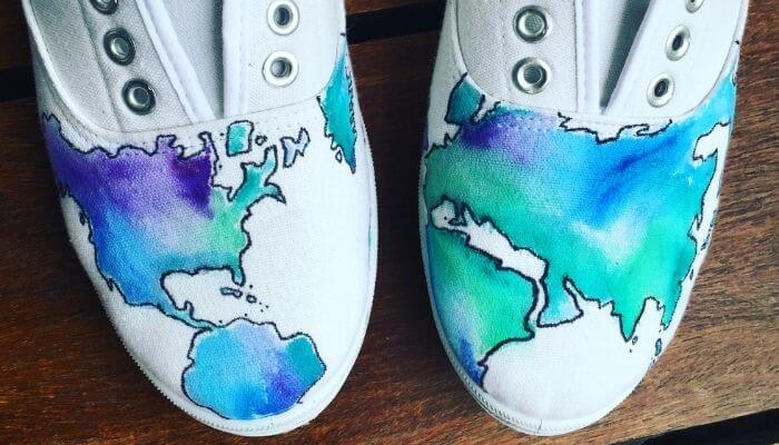 shoes painted with a map of the world
